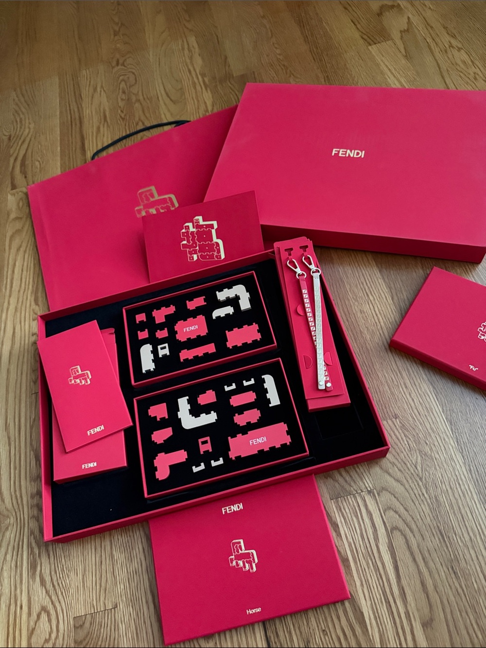 Fendi Boutique Lunar New Year 2026 wooden puzzles, keychains and envelopes.